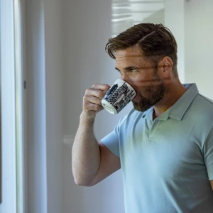 A man drinks coffee.