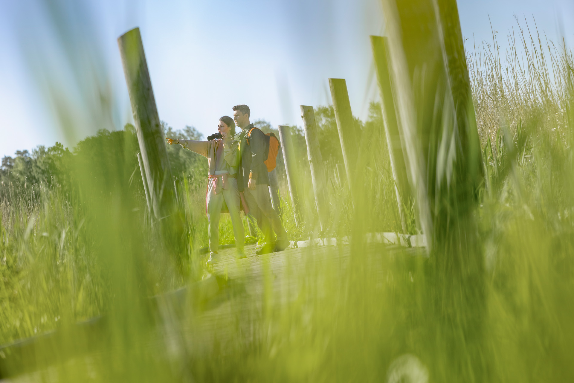 A woman and a man exploring nature.